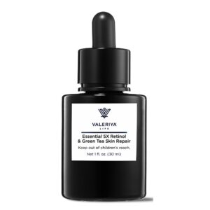 The image displays a bottle of "Essential 5X Retinol Green Tea Skin Repair" from the brand Valeriya Life. The bottle has a sleek, dark design with a white label featuring the product name and logo. The label includes clean, minimal text with subtle white accent, reflecting the product’s ingredients. The bottle is positioned on a soft, neutral background, emphasizing its professional and sophisticated appearance.