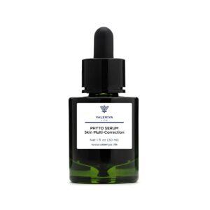 The image shows a bottle of "Phyto Serum Skin Multi-Correction" from the brand Valeriya Life with a sleek, black design. The bottle has a dropper cap. The background is neutral, allowing the focus to be on the clean and minimalistic packaging. The label includes key product ingredients.