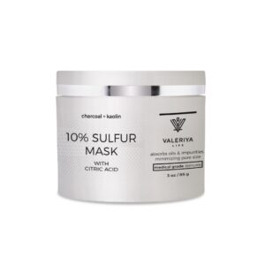 The image shows a jar of "10% Sulfur Mask" from the brand Valeriya Life, featuring a sleek, silver container with a silver lid. The label on the jar is clear and modern, displaying the product name, key ingredients and benefits in a clean font. The jar is placed against a simple, light-colored background, emphasizing the product’s minimalist and professional design. This mask is formulated with sulfur to treat acne and blemishes, helping to purify and clarify the skin.