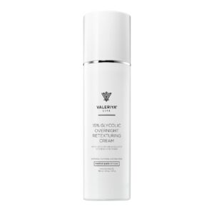 The image shows a bottle of "15% Glycolic Overnight Retexturing Cream" from the brand Valeriya Life featuring a sleek, white design. The label includes product name, key ingredients and benefits. The background is light and neutral, emphasizing the clean and minimalistic design of the packaging.