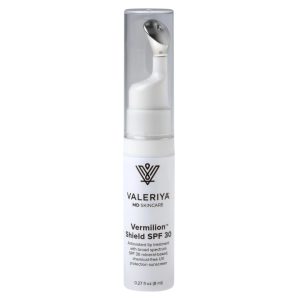 White pump tube of Valeriya MD Skincare Vermilion™ Shield SPF 30, a mineral-based antioxidant lip sunscreen with metal applicator tip, 0.27 fl oz.